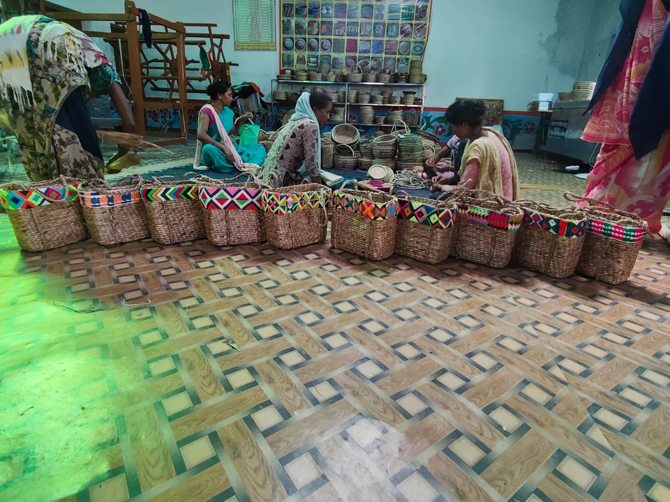 Women taking part in traditional basket weaving and livelihood training