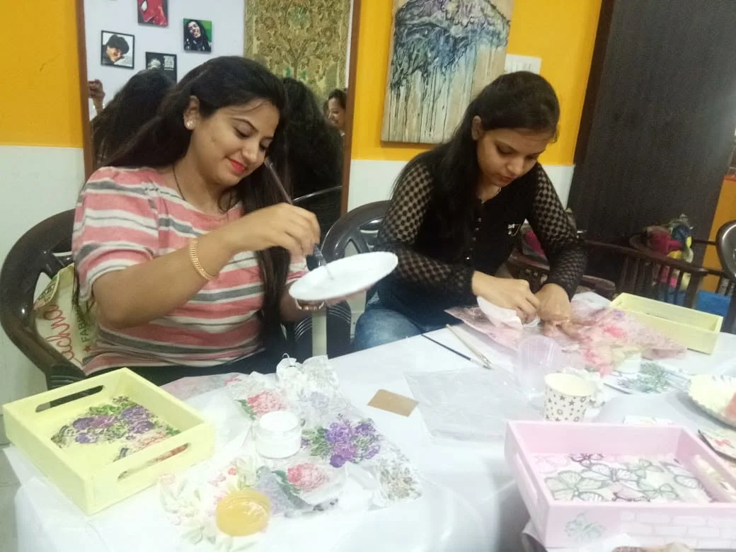 Women painting together during a creative workshop
