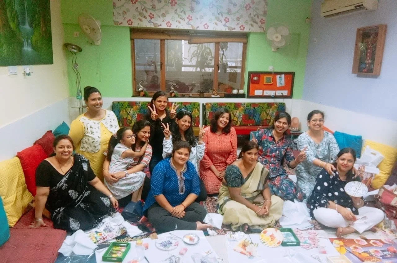 A group of women smiling after a creative workshop