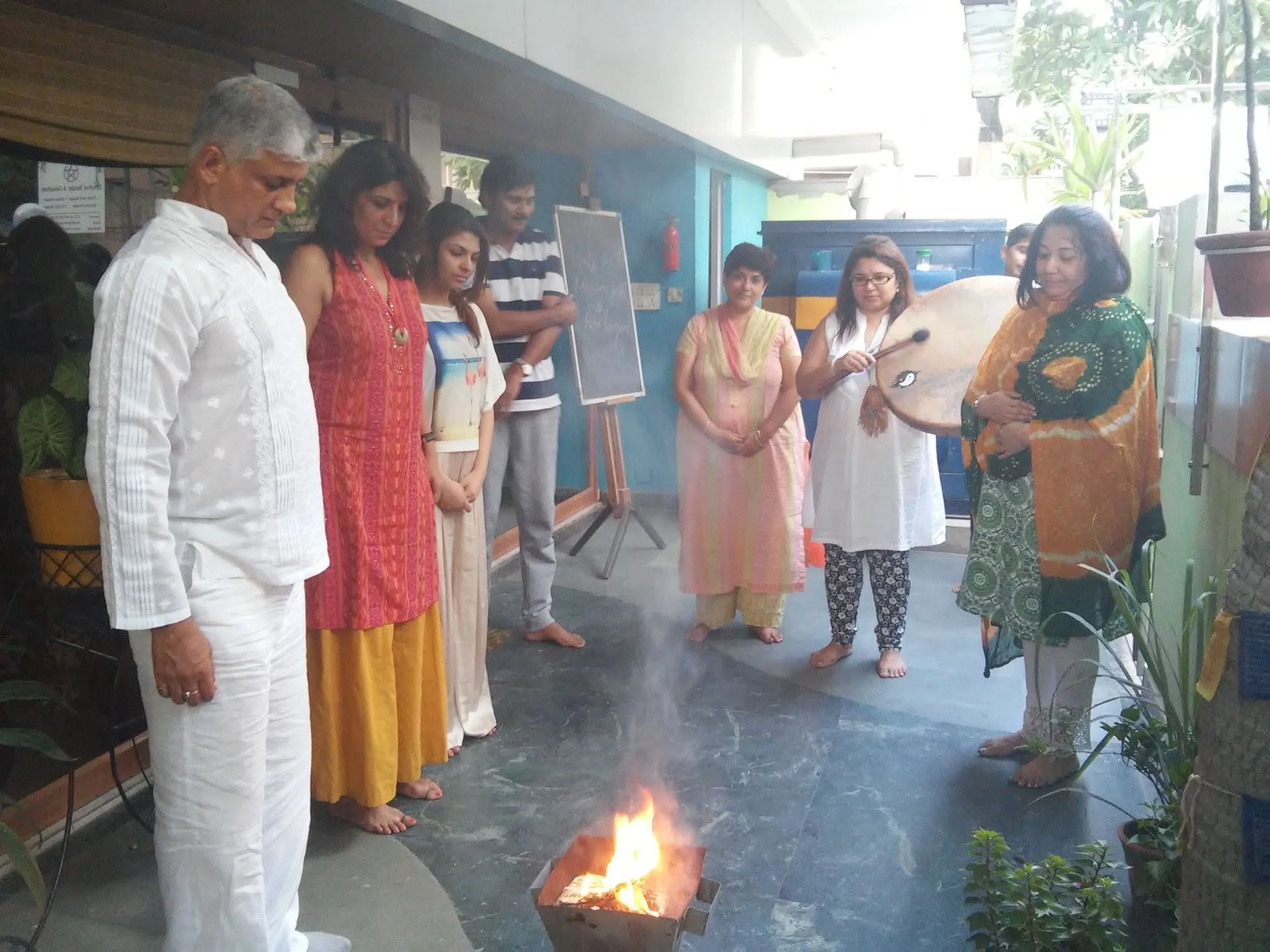 People gathered around a ceremonial hawan fire
