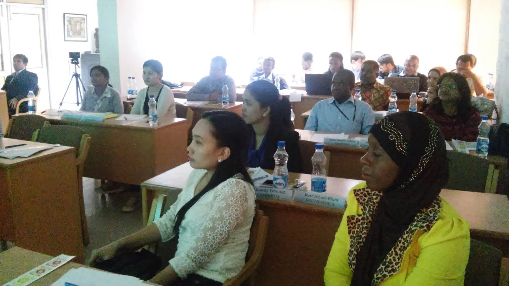 A mixed group of attendees taking part in an awareness session